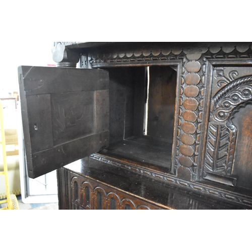 495 - An Early Carved Oak Court Cupboard the Base Section with Carved and Panel Doors to Shelved Interior,... 