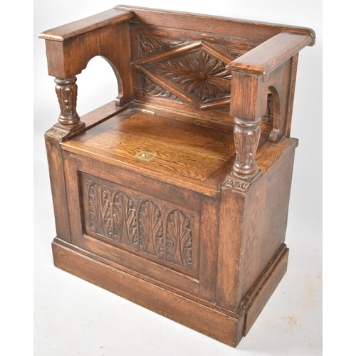 73 - A Carved Oak Single Settle with Hinged Box Seat, 70cm wide