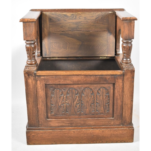 73 - A Carved Oak Single Settle with Hinged Box Seat, 70cm wide