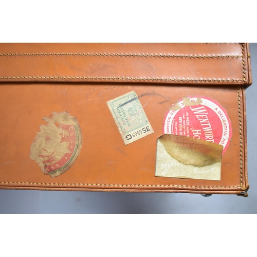 88 - A Vintage Leather Suitcase with Paper Labels to Include SS United States, 61cm wide