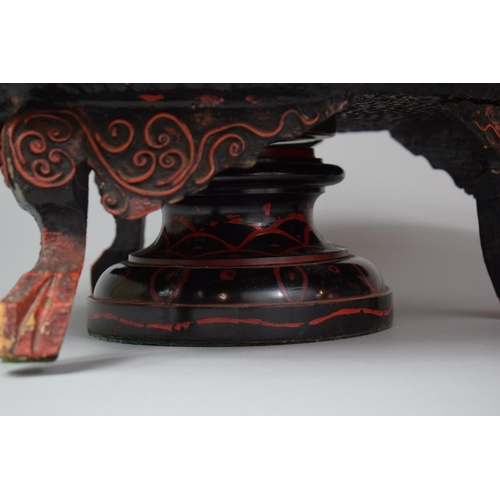 92 - An Oriental Lacquered Lazy Susan with Three Scrolled Carved Feet, 46cm Diameter