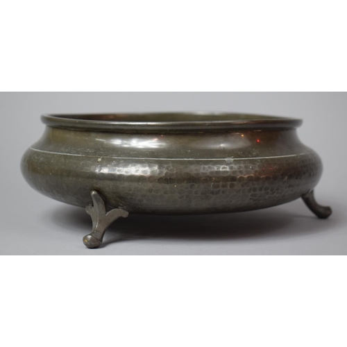 96 - A Mid 20th Century Hammered Pewter Circular Bowl on Three Scrolled Feet, 25cm Diameter