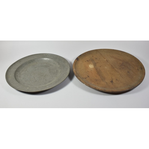 107 - A Circular Wooden Trencher, 42cm Diameter and a Pewter Charger, 38cm diameter