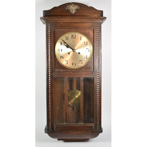 140 - An Edwardian Oak Cased Wall Clock with Eight Day Movement, 7cm high