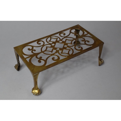 141 - Two 19th Century Pierced Brass Rectangular Trivet Stands, One with Lion Decoration, 29cm Long