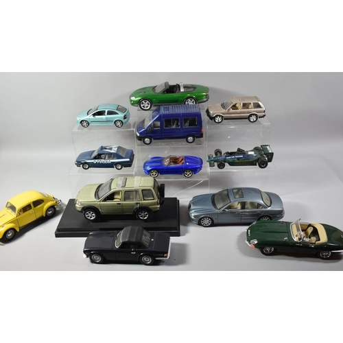 195 - A Collection of 12 Various Diecast Models of Cars, Racing Cars 007XKR etc