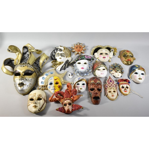 214 - A Collection of Various Wall Hanging Ceramic and Metal Masks