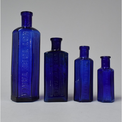 247 - A Collection of Four Cobalt Blue Glass Chemist Bottles