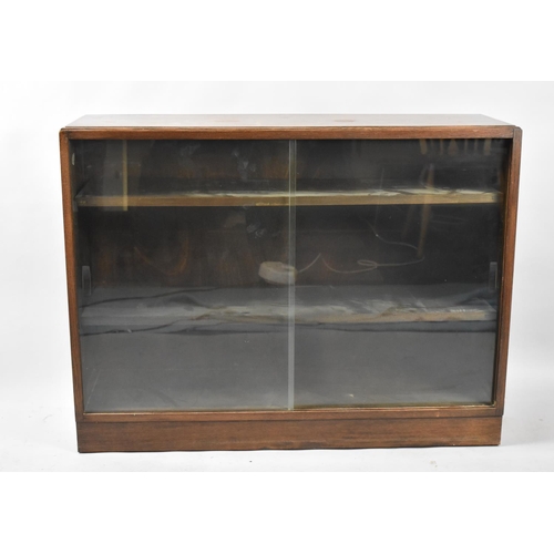 539 - A Mid 20th Century Oak Glazed Bookcase with Sliding Doors, 100cm wide