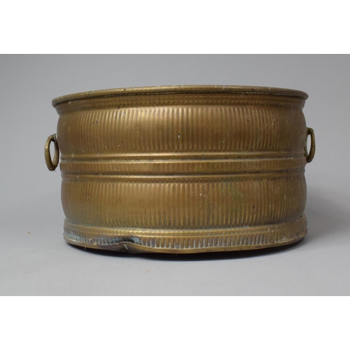 542 - A Circular Two Handled Brass Planter, 30cm diameter