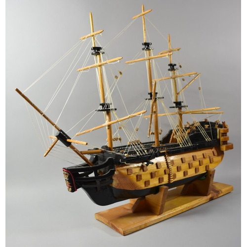 71 - A Modern Wooden Model of a Three Masted Warship, 73cm wide