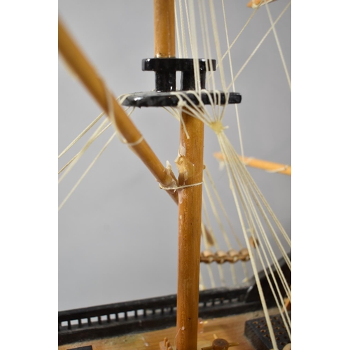 71 - A Modern Wooden Model of a Three Masted Warship, 73cm wide