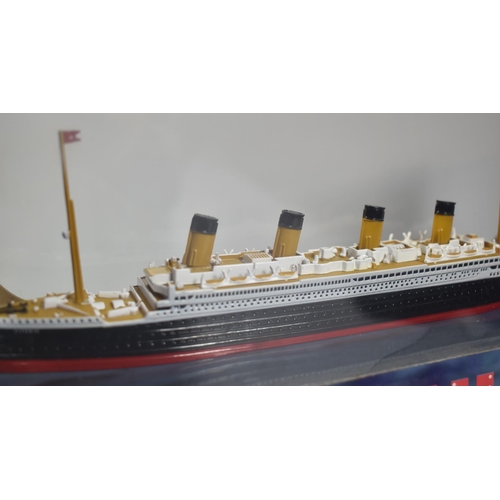 73 - A Boxed Diecast Model of the Titanic Together with a Miniature Model