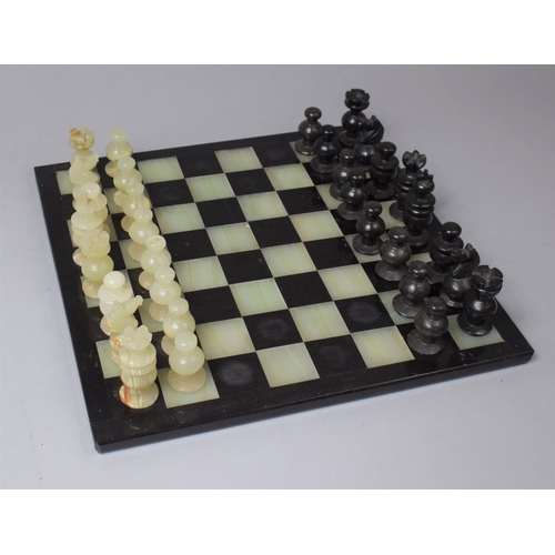 141 - A Onyx Chess Set and Board, 36cm Square