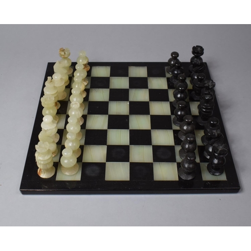 141 - A Onyx Chess Set and Board, 36cm Square