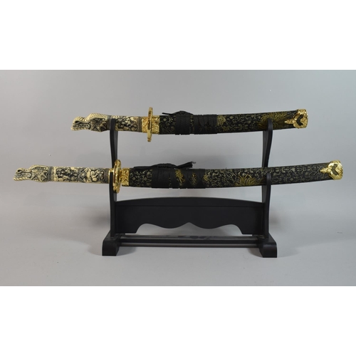 161 - A Pair of Reproduction Dragon Headed Gilt Mounted Japanese Sword on Stands, Longest 75cm