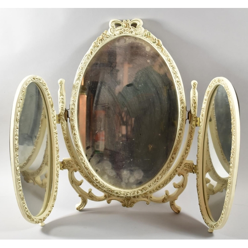 165 - A Cream and Gilt Triple Dressing Table Mirror with Moulded Decoration, 56cm high