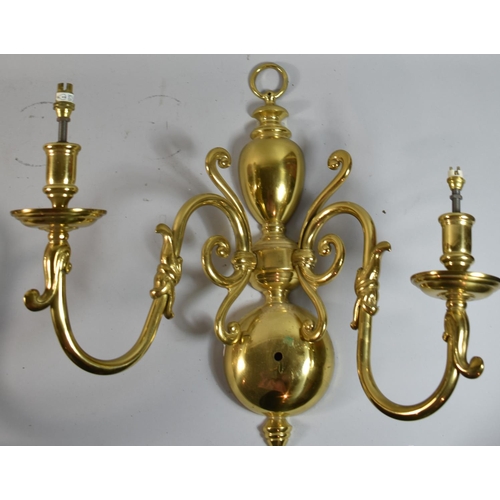 200 - A Pair of Dutch Style Brass Two Branch Wall Hanging Light Fittings