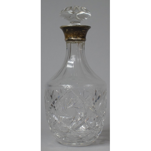 462 - A Silver Topped Cut Glass Decanter with Stopper, 26.5cm high