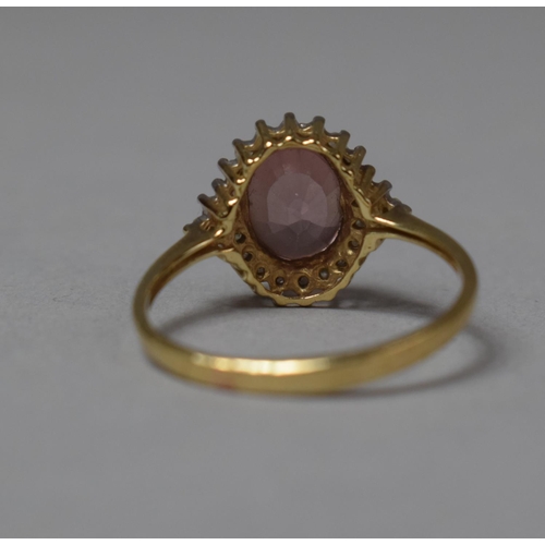 488 - A 9ct Gold Mounted Diamond and Pink Sapphire Dress Ring, Size O