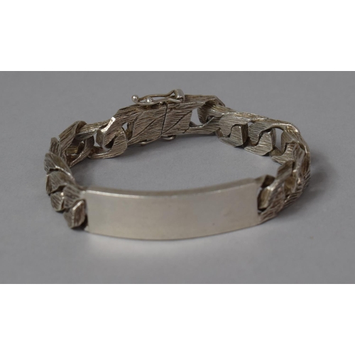 501 - A Heavy Unmarked Silver Curb Bracelet with Bark Finish, 20cm Long, 66g