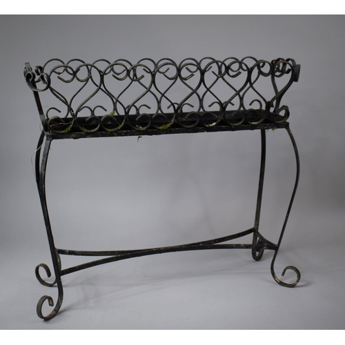 542 - A Wrought Iron Plant Stand, 68cm wide