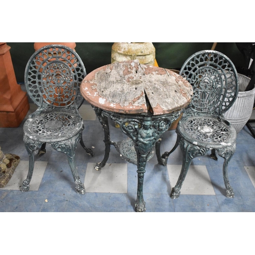 588 - A Green Painted Cast Metal Table and Pair of Chairs, In Need of Renovation