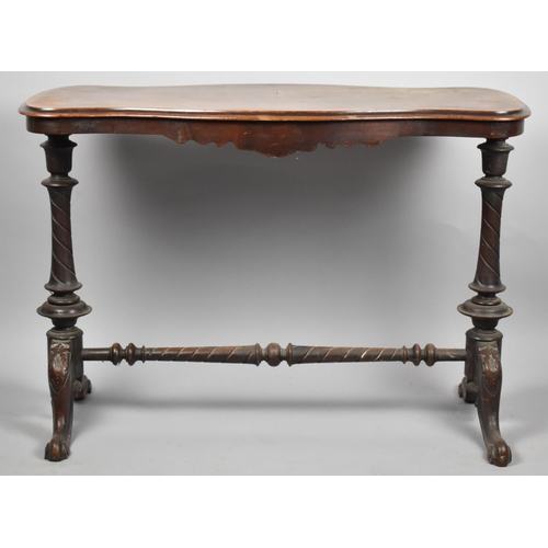 645 - A Victorian Walnut Serpentine Shaped Side Table on Turned Supports with Scrolled Seet, 97cm Wide