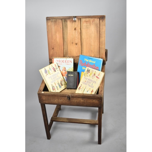 653 - A Late 19th/Early 20th Century Childs Desk with Hinged Sloping Writing Surface, Two Ink Bottles and ... 