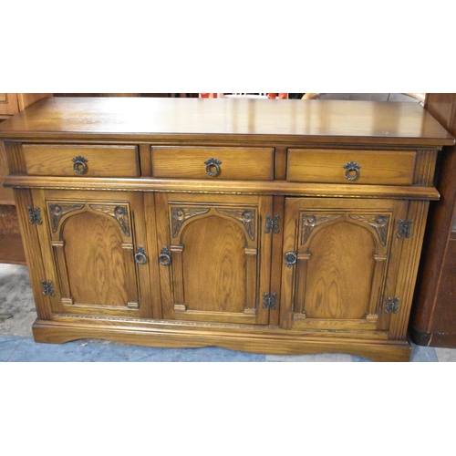 658 - A Mid 20th Century Three Drawer Sideboard with Cupboard Base