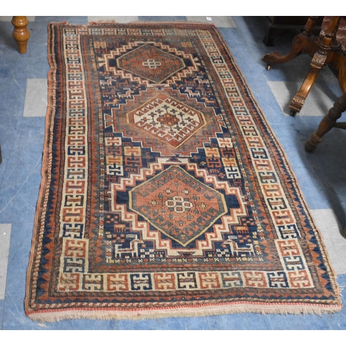 671 - A Patterned Woollen Rug, 186cmx102cm