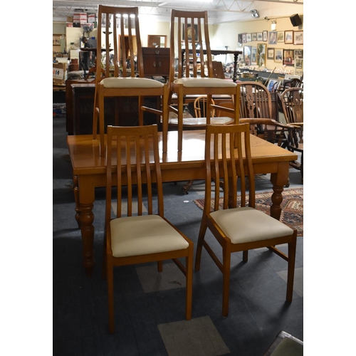 675 - A Modern Rectangular Dining Table and Four Chairs, 150x90cm