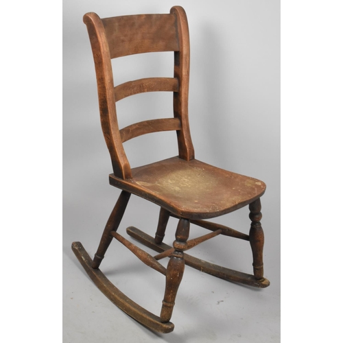 676 - A Late 19th Century Ladder Back Rocking Chair