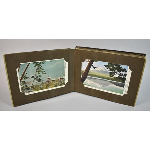 68 - A Small Japanese Lacquered Album Containing 50 Postcards of Japan