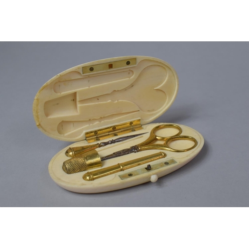 76 - A Late 19th Century Ivory Cased French Necessaire with Silver Gilt Scissors, Thimble, Needle Case et... 