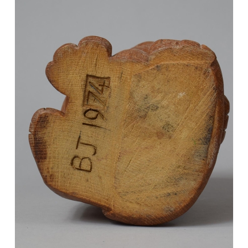 99 - A Carved Wooden Humorous Study of a Seated Morose Cat, The Base Monogrammed BJ 1974, 18cm high