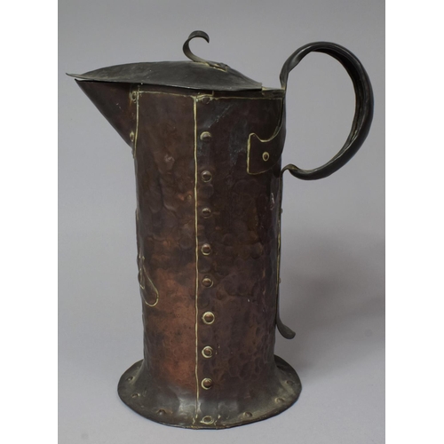 43 - An Arts and Crafts Hammered Copper Lidded Jug, Stamped for William Soutter & Sons with Riveted Side ... 