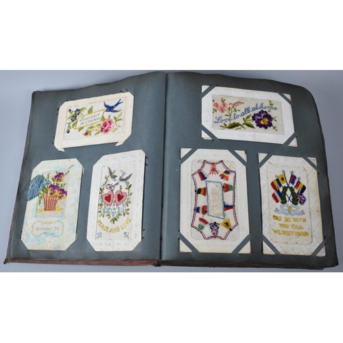 62 - An Early 20th Century Postcard Album Containing 32 WWI Silk Embroidered Examples Together with a Few... 