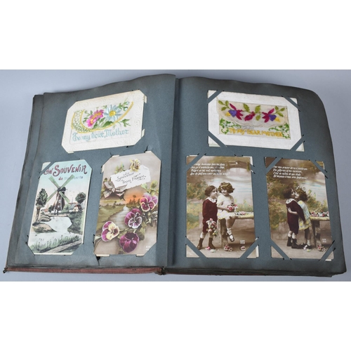 62 - An Early 20th Century Postcard Album Containing 32 WWI Silk Embroidered Examples Together with a Few... 