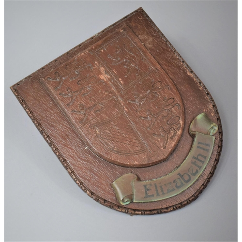 101 - A Wooden Wall Hanging Shield with the Royal Crest and Inscribed Elizabeth, 32cm high