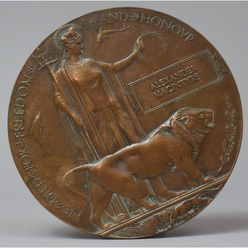 121 - A WWI Bronze Death Plaque Inscribed In the Memory of Alexander Macintyre, 12cm Diameter