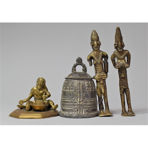 159 - A Far Eastern Brass Figure of Seated Tradesman, Two African Brass Figures and a Bell