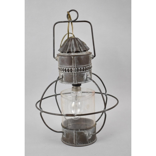 187 - A Ceiling Hanging Metal Light Fitting in the Form of a Lantern, 34cm high