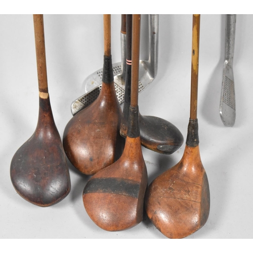 207 - A Collection of Eight Vintage Golf Clubs to Include One Hickory Shafted Driver and the Remainder Met... 