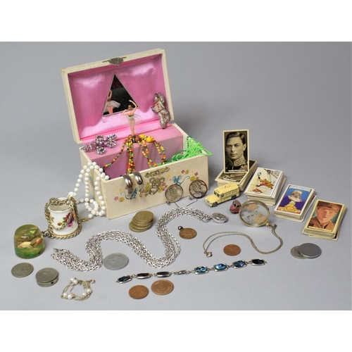 236 - A Small Musical Jewellery Box Containing Coins, Cigarette Cards, Costume Jewellery etc