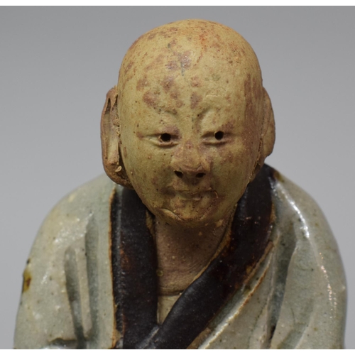 264 - A Chinese Glazed Stoneware Figure Group Depicting Scholar Seated on Temple Lion/Foo Dog, 21cm high