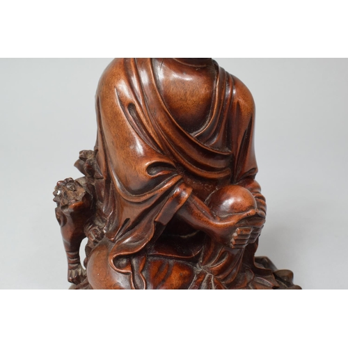 272 - A Chinese Root Wood Figure of a Sage on Stand, 22cm high