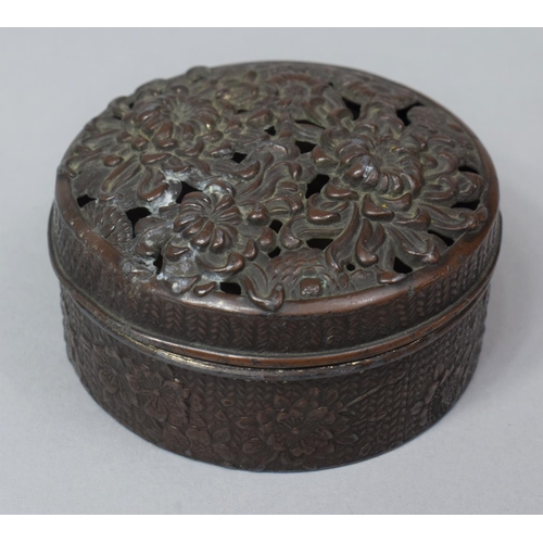 274 - An Oriental Bronzed Circular Lidded Pot with Pierced Lid, 6.5cm diameter