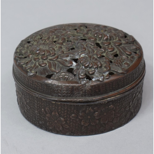 274 - An Oriental Bronzed Circular Lidded Pot with Pierced Lid, 6.5cm diameter