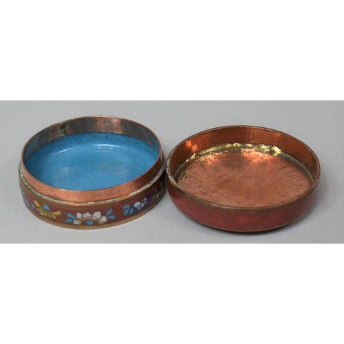 278 - A Small Circular Cloisonne Box on Red Ground with Multicolored Floral Enamels, 5cm Diameter